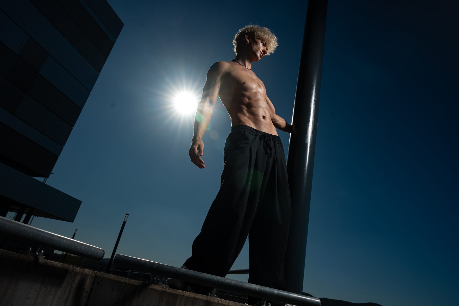 Fitness portrait, on a rooftop, in sunlight