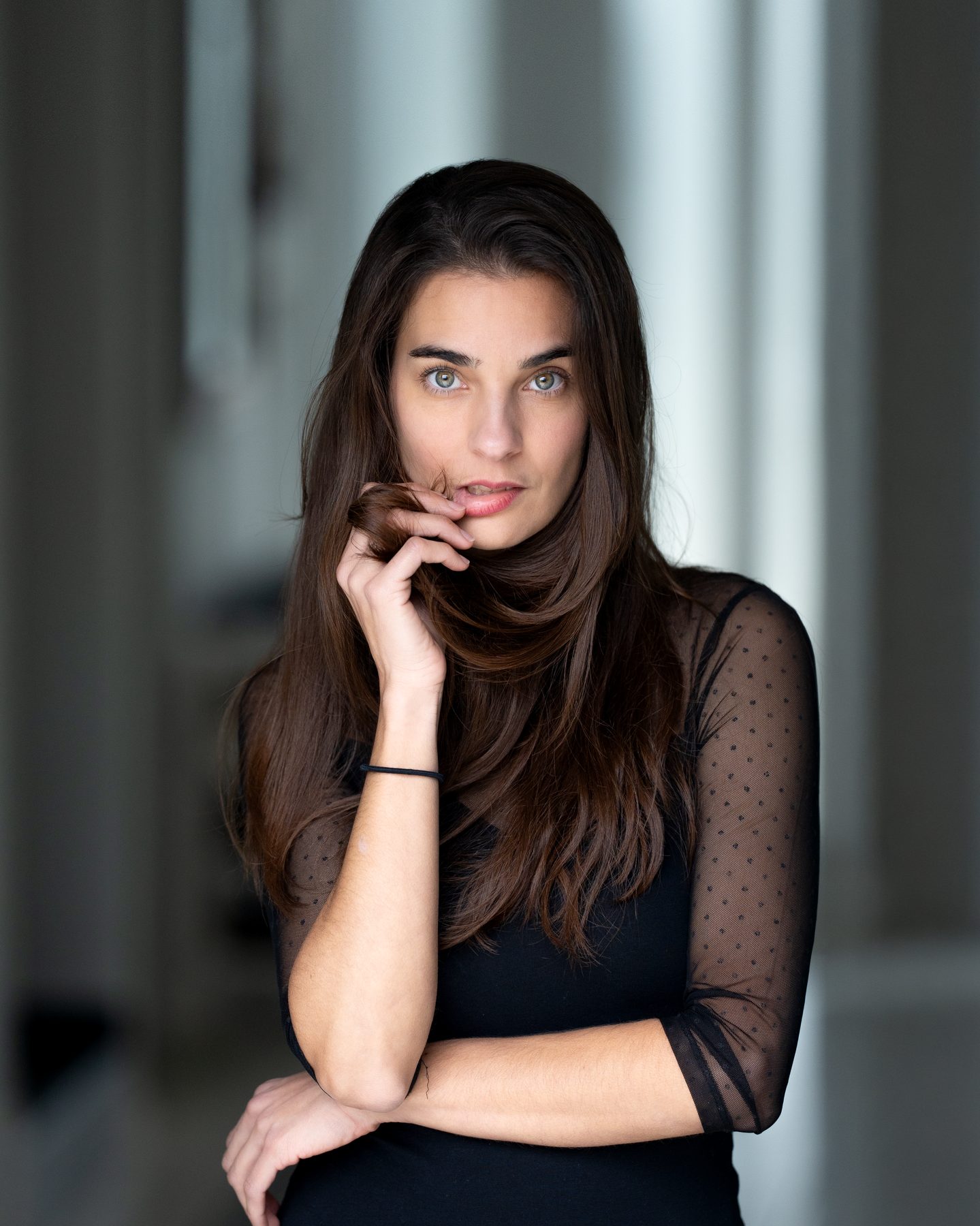 Close-up portrait, in a black polka-dot blouse