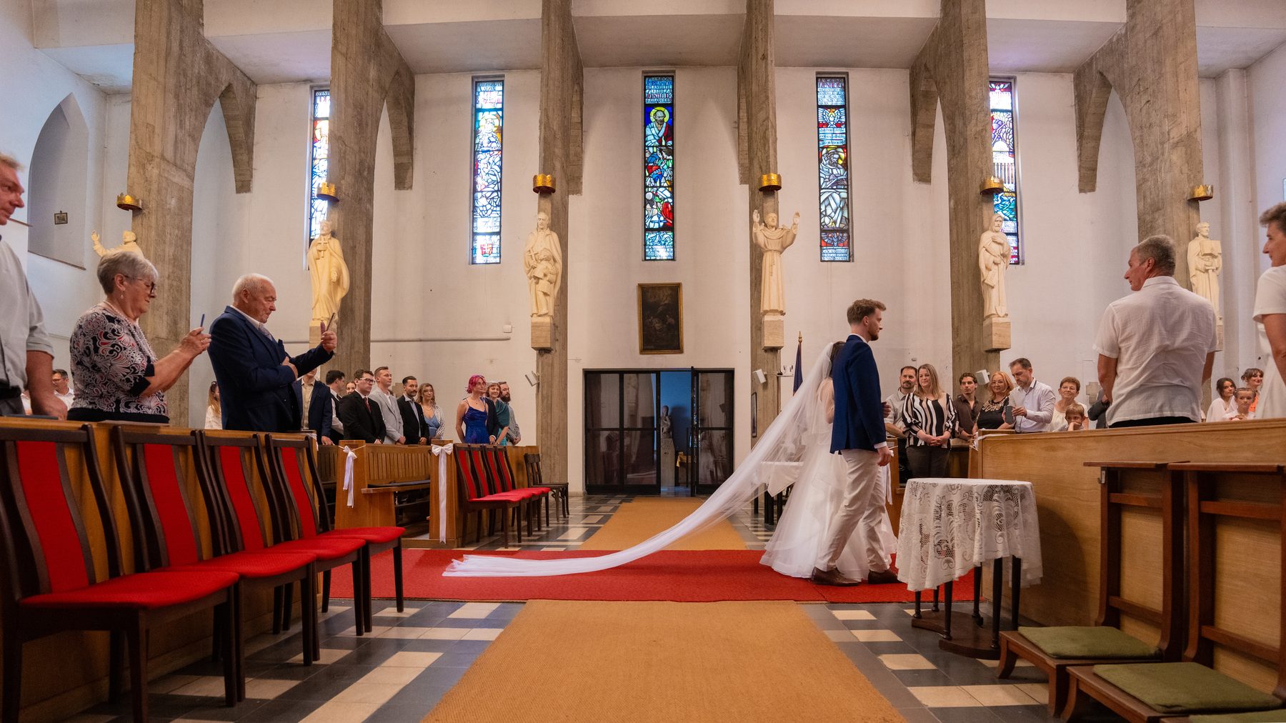 Bride and groom walking to the altar